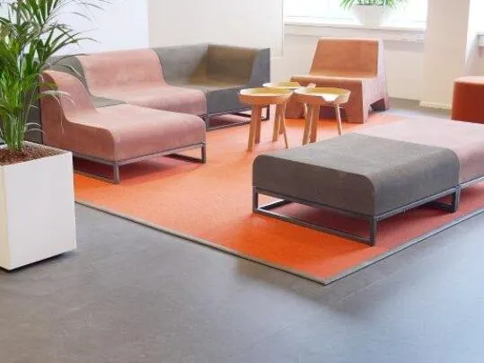 Cooloo furniture made from a Marmoleum powder coating, placed in the EEMCS building of the TU Delft