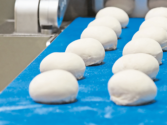 Homogenous belts for dough processing