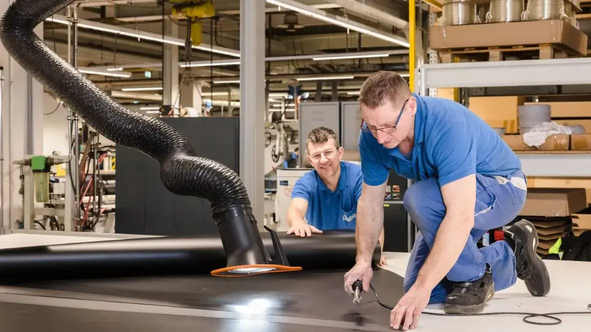 Our staff fabricating a customized curved belt