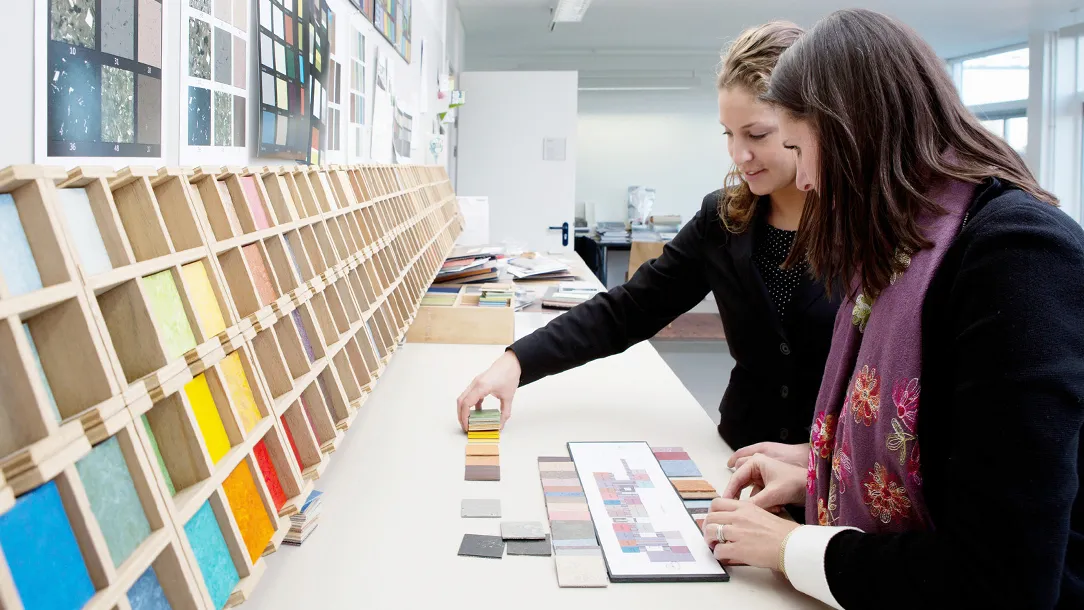 The Forbo design team at work with various color samples.