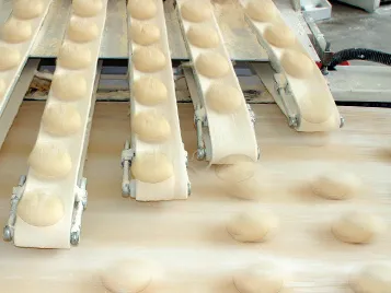 Conveyor belts for dough processing