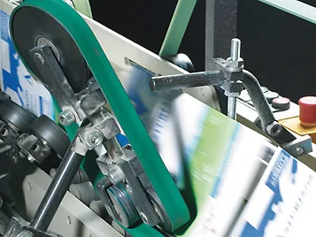 Paper  and printing: Forbo Siegling Extremultus  flat belts in use in a packing machine.