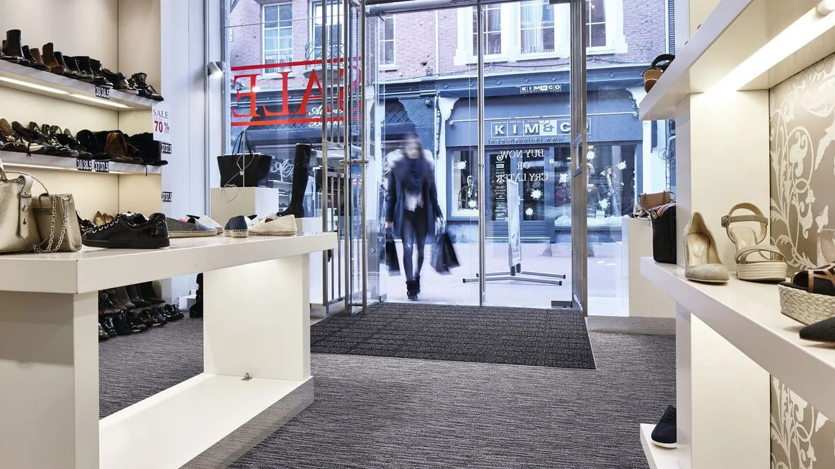 Coral click retail entrance flooring installed in a shoe shop