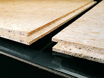 Transilon processing belt in particle board production