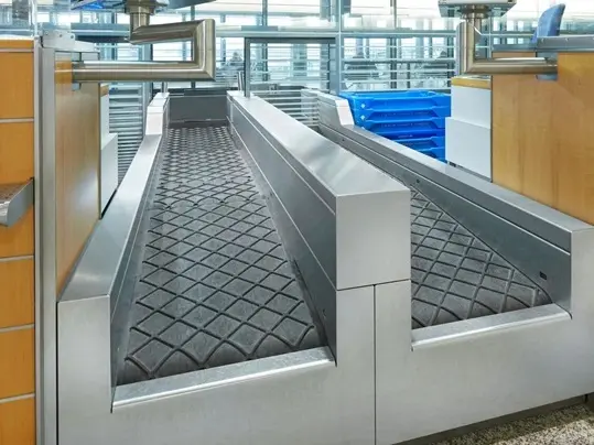 Conveyor belts move items of baggage at the check-in